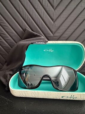 Oakley Glossy Black Shield Sunglasses with dark Lenses
